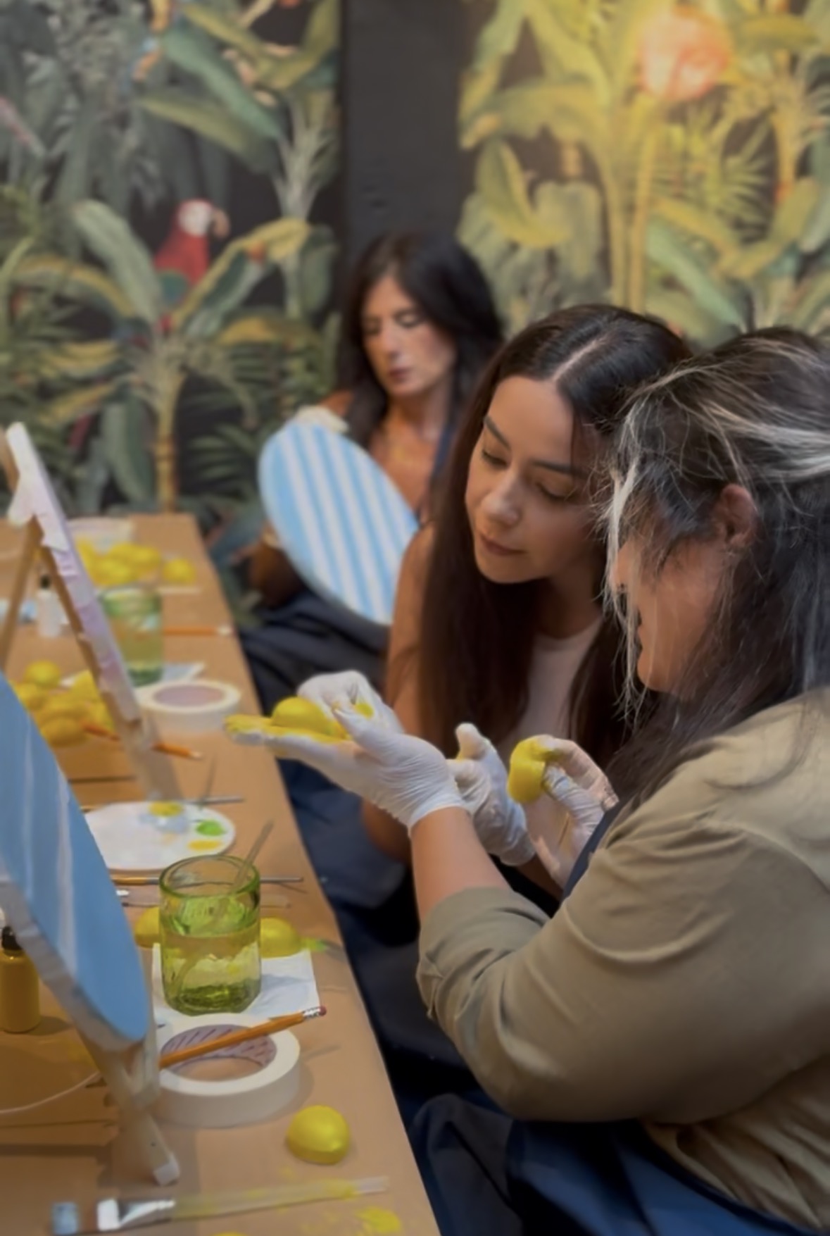 Guests working on their lemon paintings