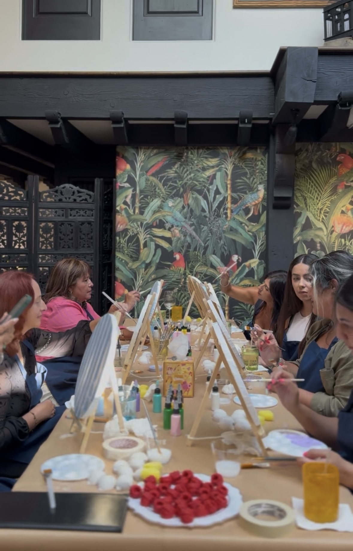 Workshop table with guests and easels