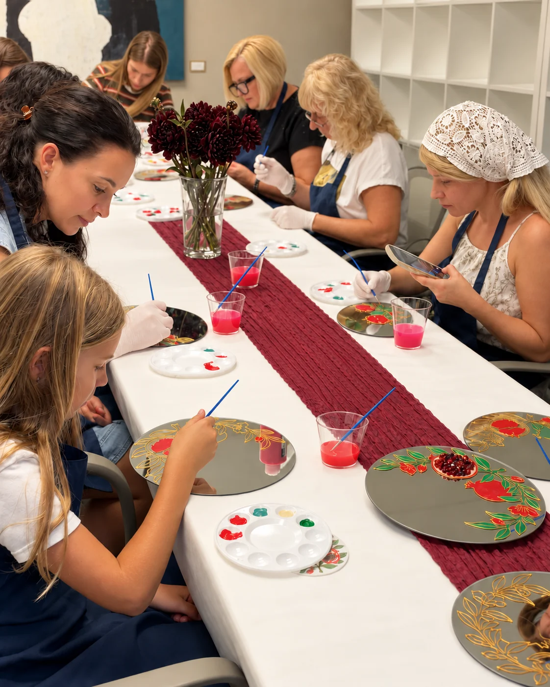 Guests creating hand-painted mirrors together at a workshop
